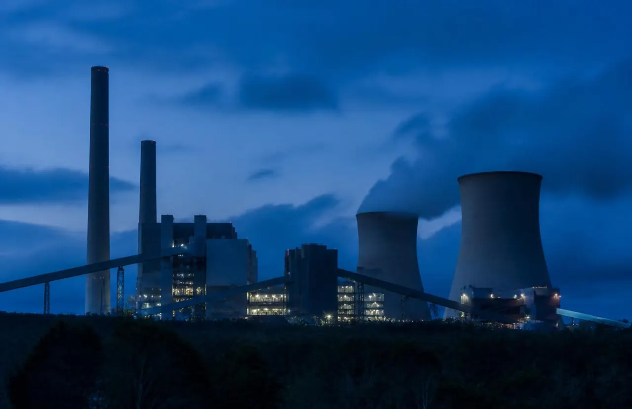 Representative image of a large thermal power plant complex at blue hour